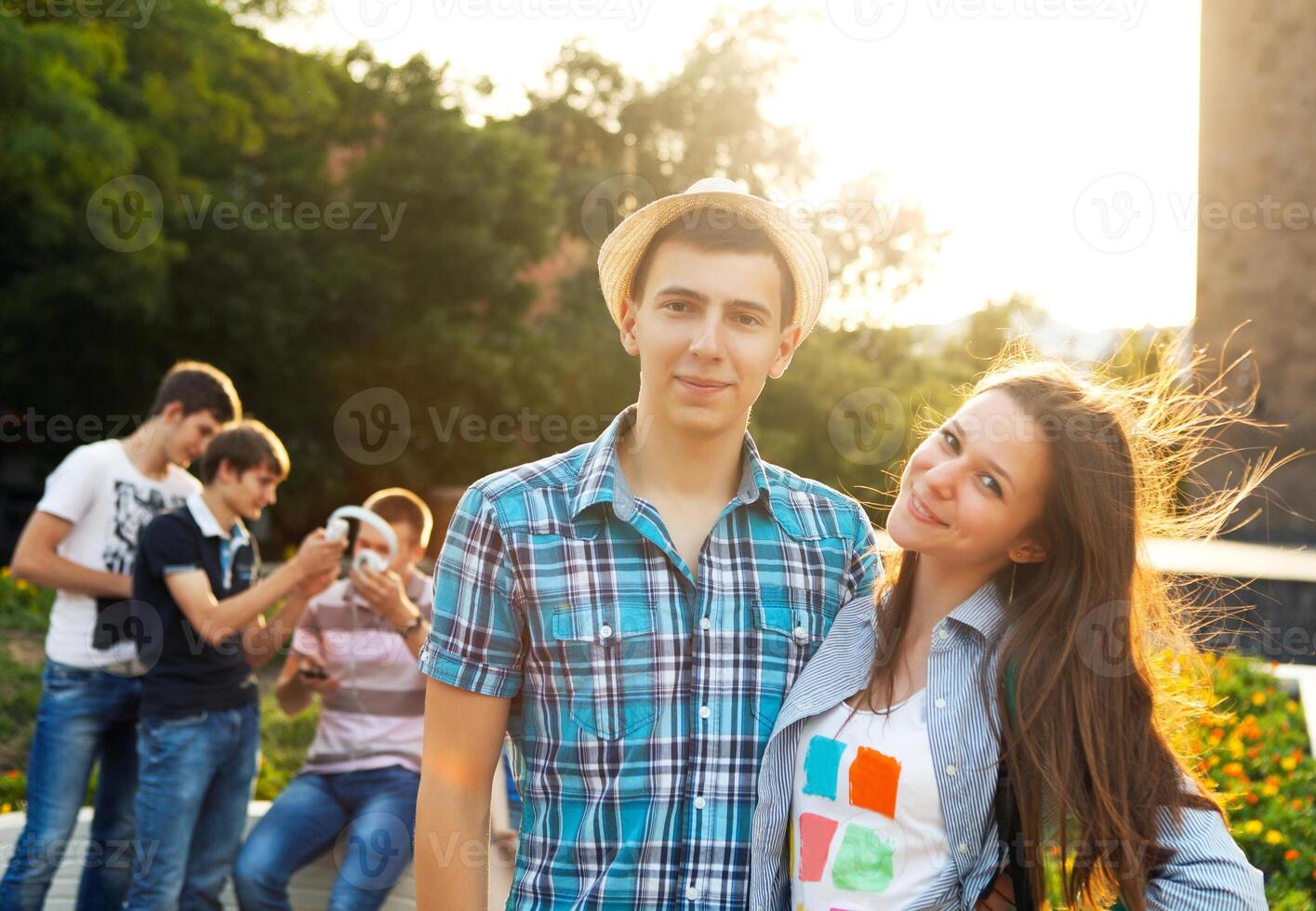 Group of students or teenagers with notebooks, outdoors photo