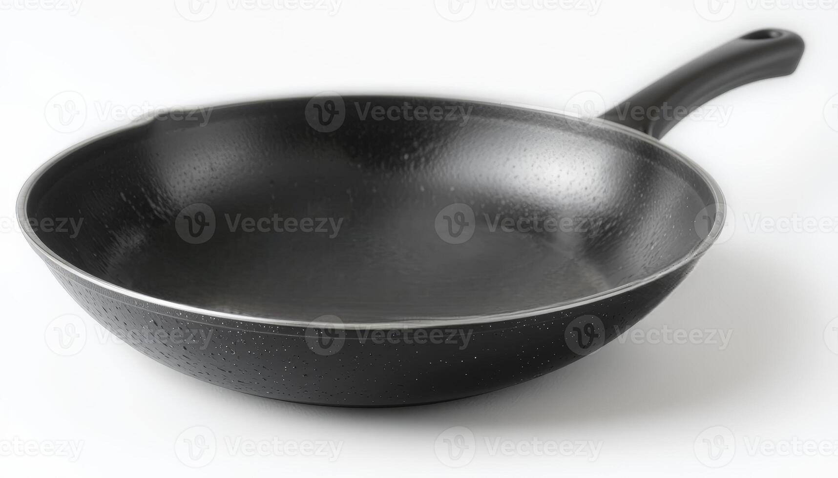 A sleek black frying pan with a smooth, non-stick surface, symbolizing modern cookware, suitable for culinary promotions, cooking shows, or kitchen supplies advertising. photo