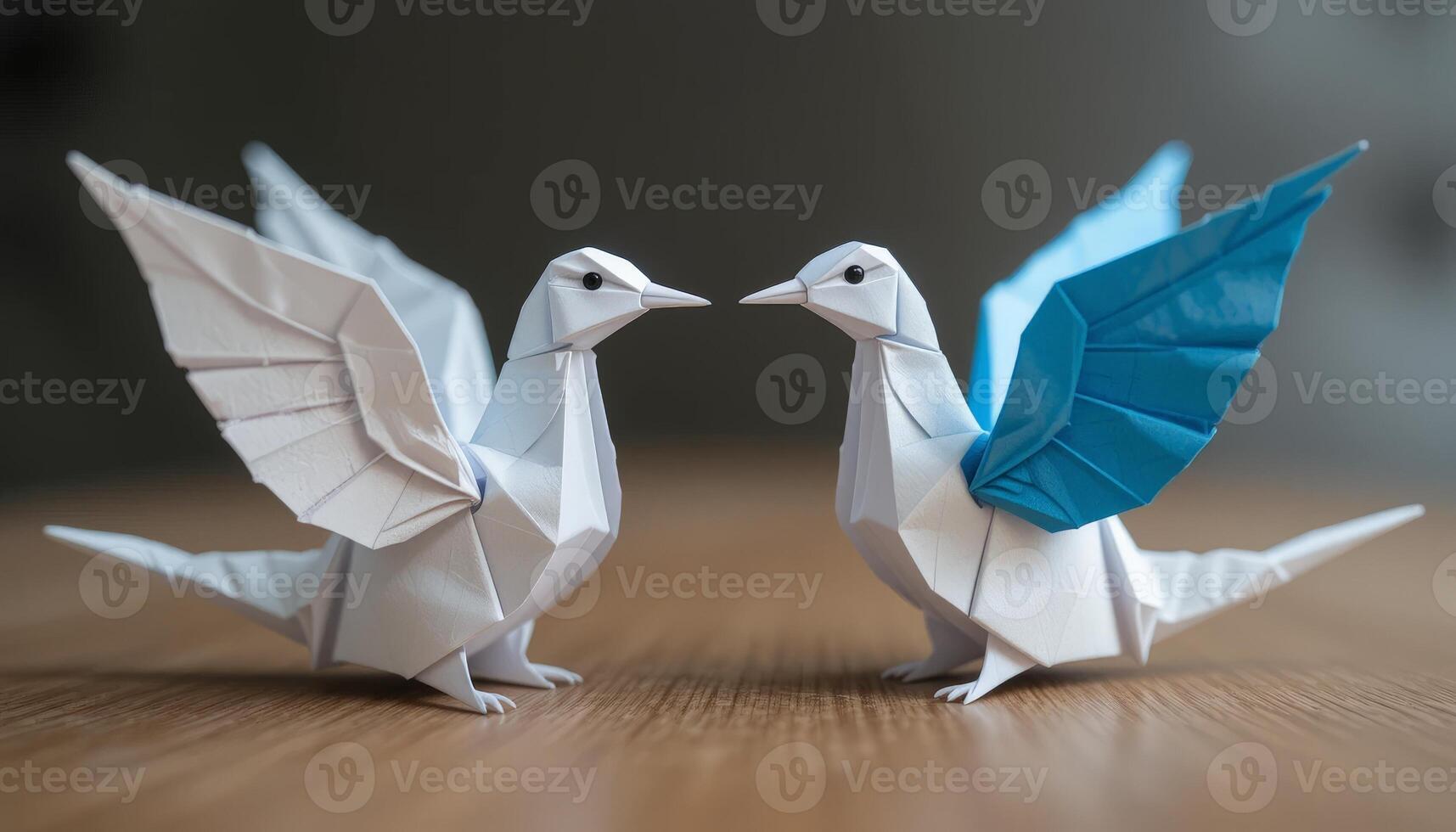 Two elegantly crafted origami birds, one blue and one white, standing face to face, ideal for artistic expressions, crafts, and educational materials about paper art. photo