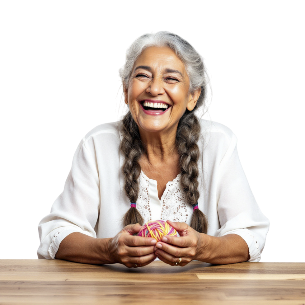 A woman with braids sitting at a table with a smile png