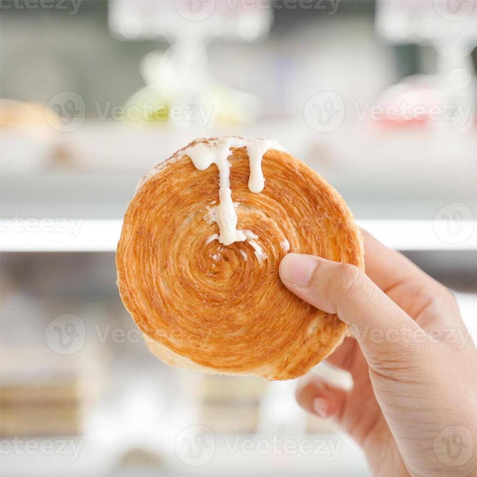 Ladies Hand Holding Cromboloni Vanilla photo
