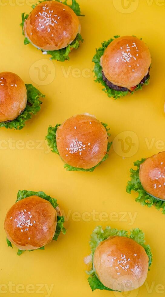 Top View of Mini Burger for Isolated on Yellow Background photo