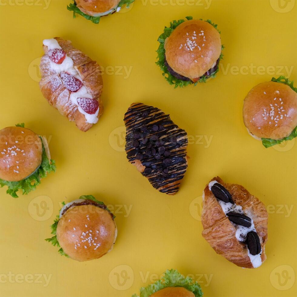 Top View of Mini Croissant Isolated on Yellow Background photo
