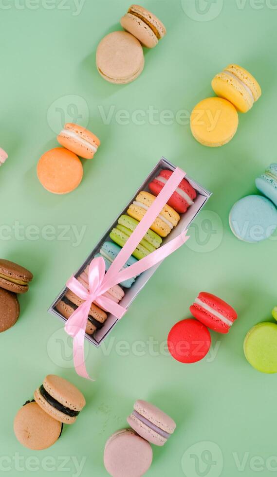 Colorful Macaron Isolated on Green background photo
