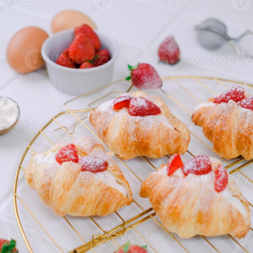 Close Up Photography of Mini Croissant Topped With Strawberry photo