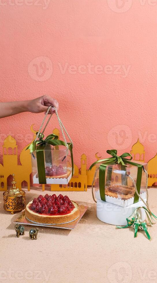 Ladies Hand Holding Ramadan ad EID Mubarak Hampers photo