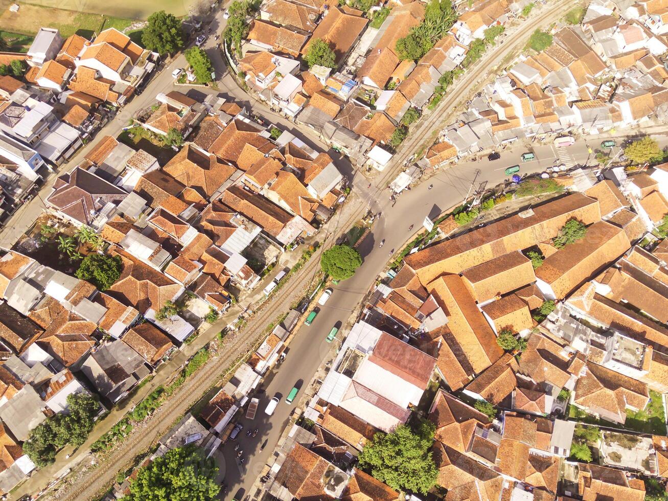Cicalengka, Indonesia. Panoramic landscape of the road junction at the railroad crossing. Cityscape of Cicalengka City from a height of 200 meters. Aerial shot from drone. Wallpaper Backgrounds. photo