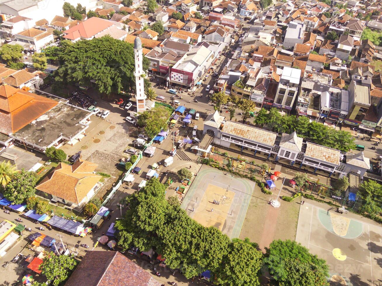 Town square and the Cicalengka Grand Mosque. Panoramic cityscape landscape from a high angle view of mosque with tower and sports court on Town square. photo