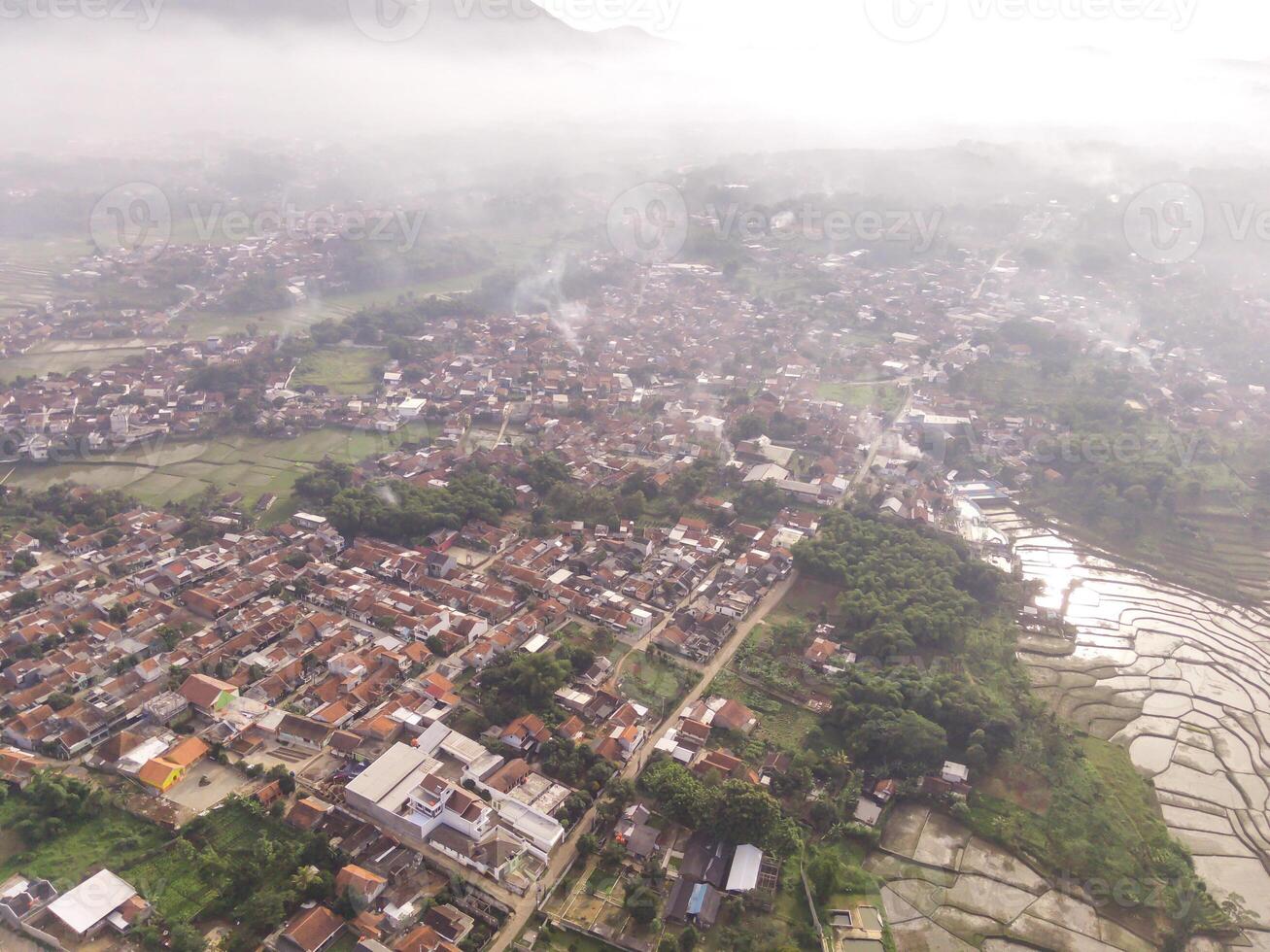 Bandung, Indonesia. Panoramic landscape settlement along the plateau. Cityscape of Bandung from a height of 200 meters. Aerial shot from drone. Negative Space photo