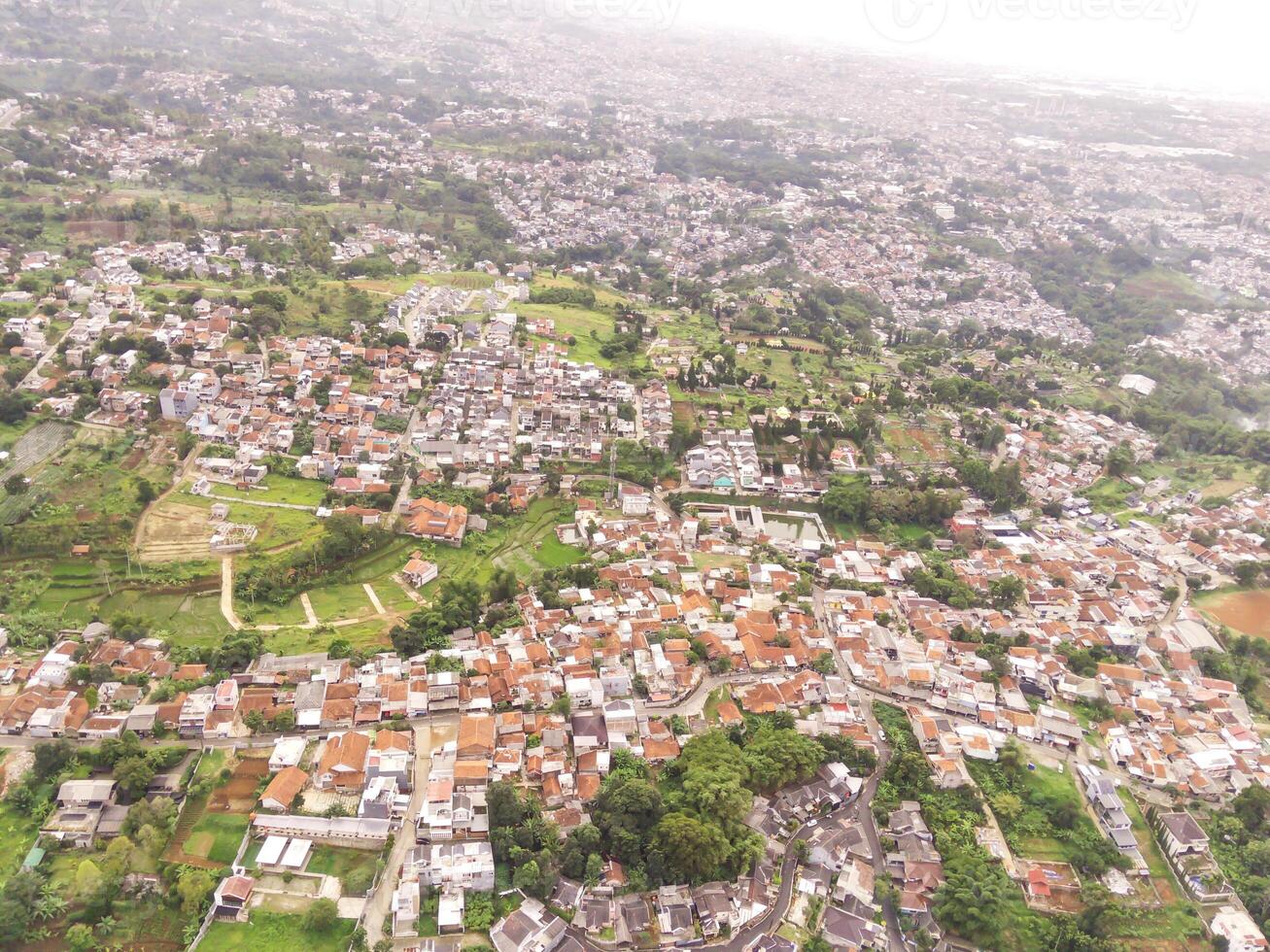 Bandung, Indonesia. Aerial Landscape view of massive civilization and population. High angle view of Residential District and Cityscape. Densely Populated Settlements. Bandung City View, Asia photo