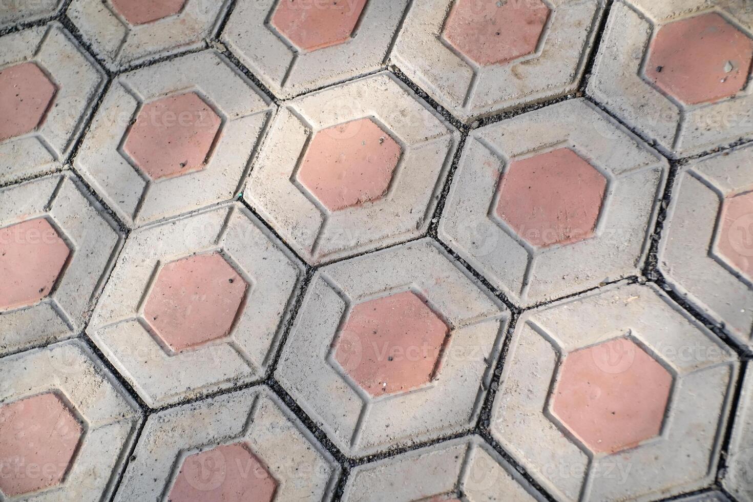 Textured backgrounds hexagonal paving blocks. Hexagonal bricks for flooring exposed to morning sunlight. Texture and Details. Bricks and blocks are made from cement. Negative Space photo