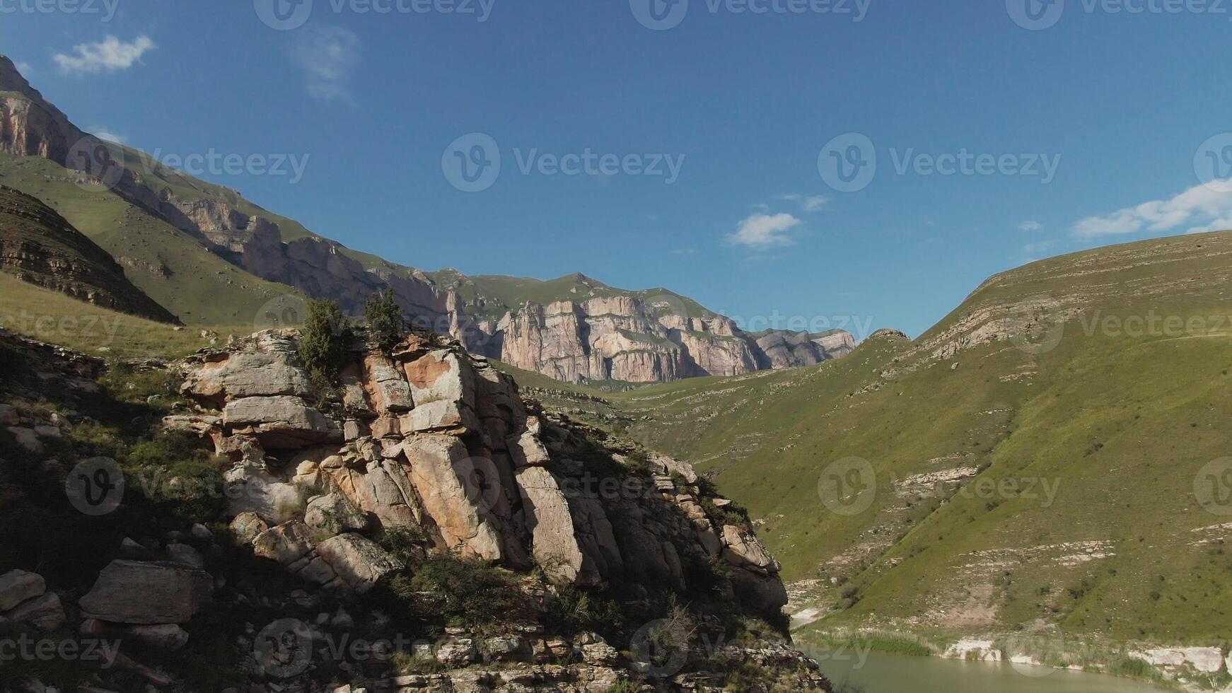 A river runs through a canyon in the mountains photo
