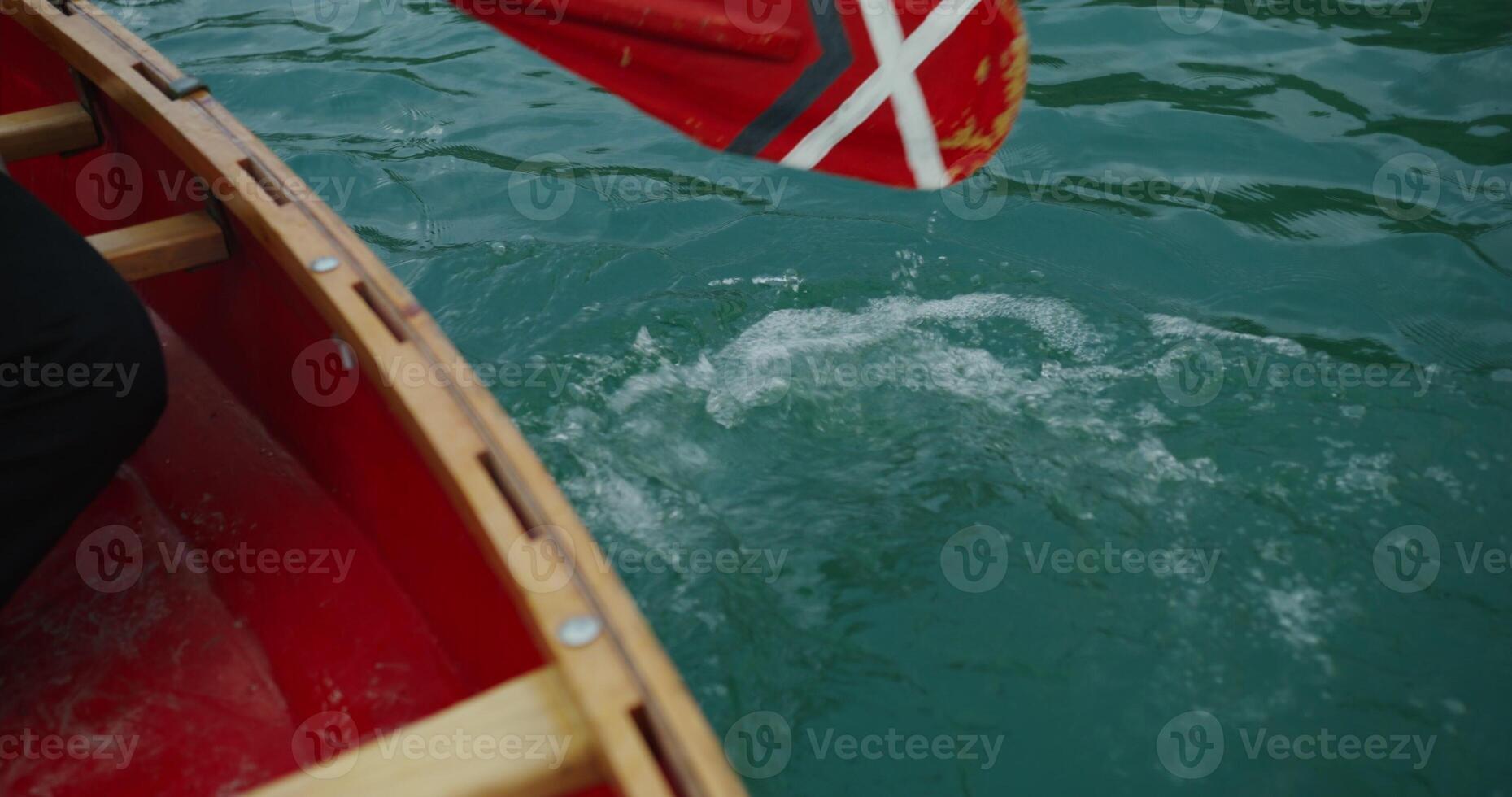 A person in a red canoe photo