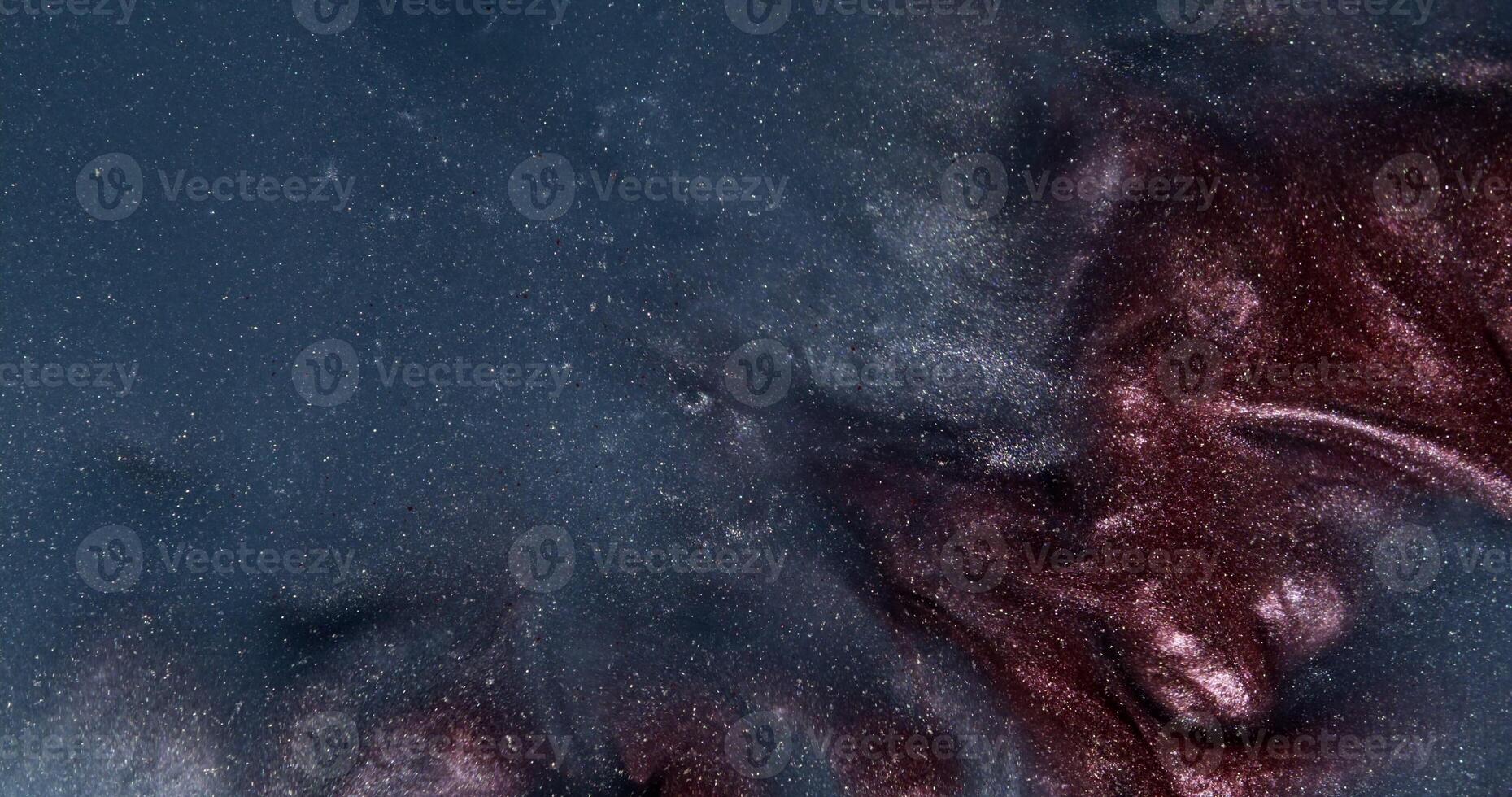A close up of a red and black liquid photo