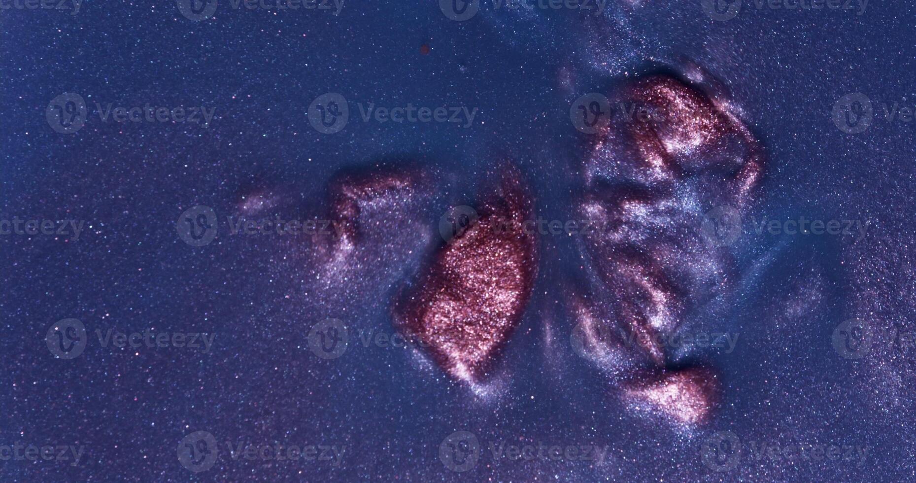 A close up of a rock with a red spot on it photo