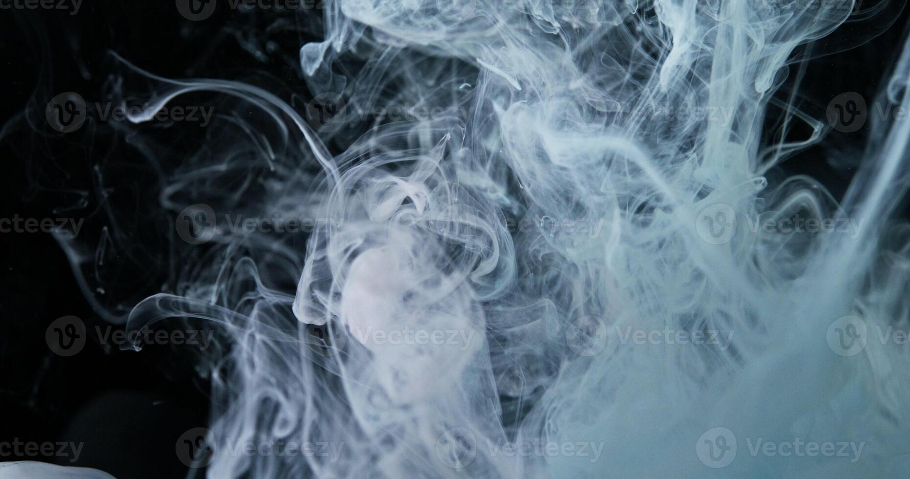 White smoke is being blown into the air photo