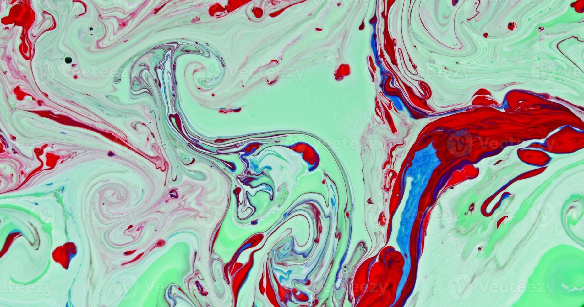 A close up of a red, green and white painting photo