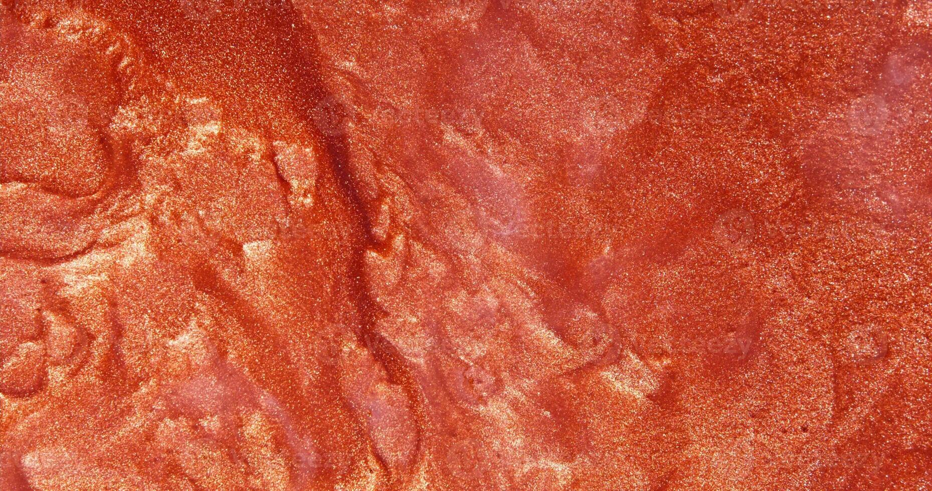 A close up of a red paint surface photo