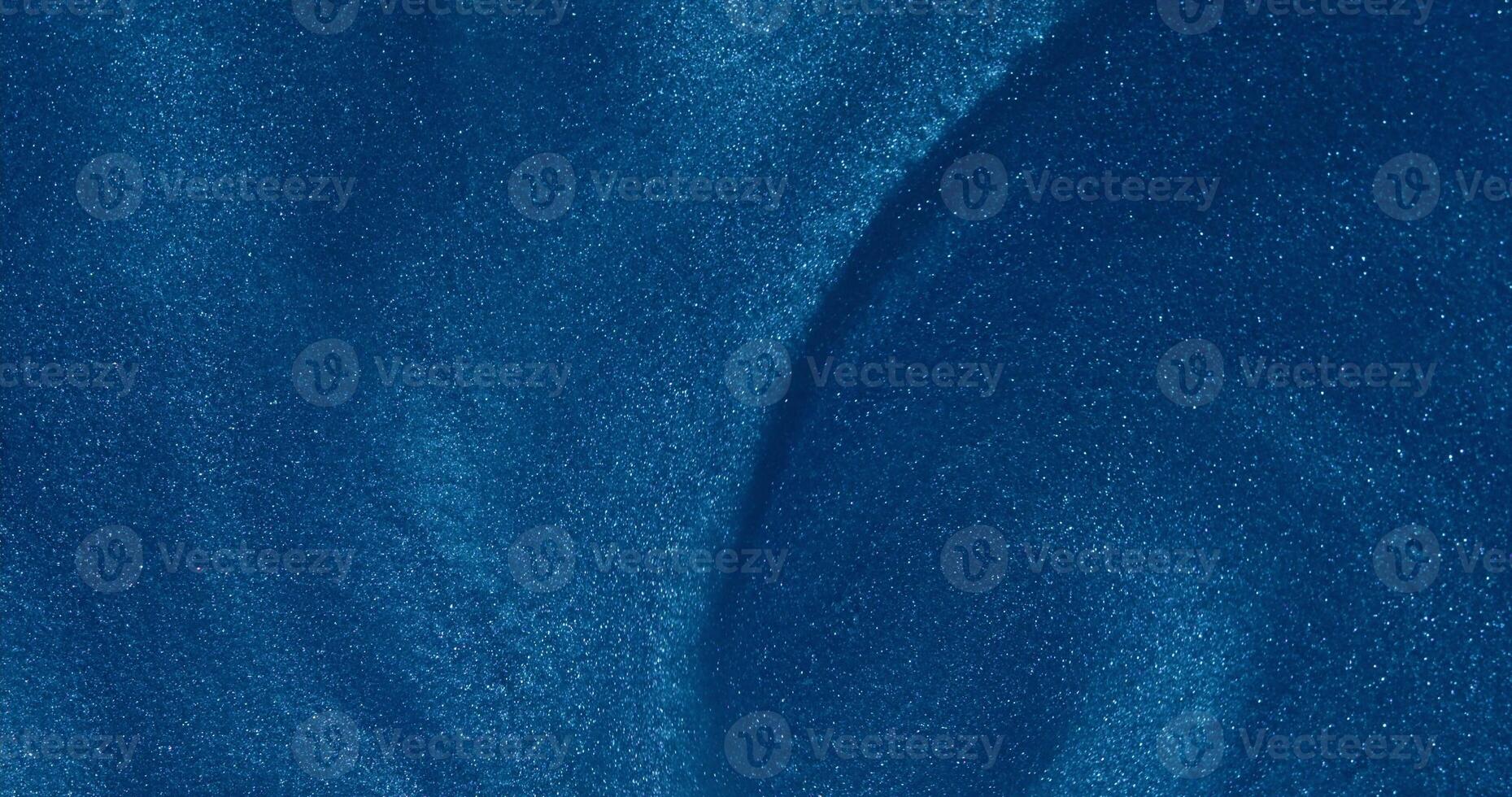 A blue background with waves and a wave photo