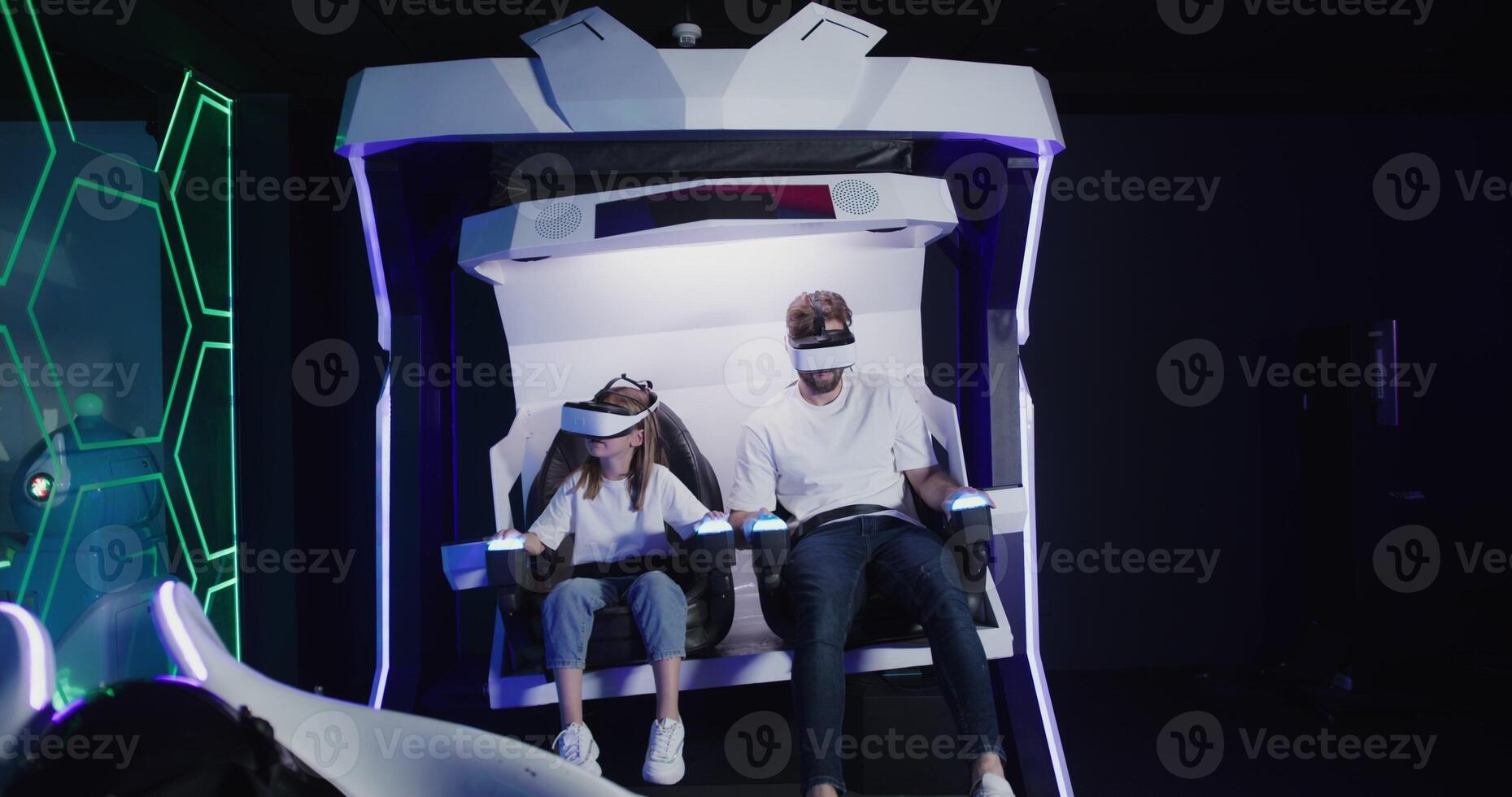 Two people in a virtual reality machine photo