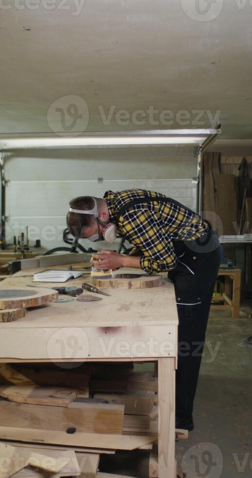 A man working on a table photo