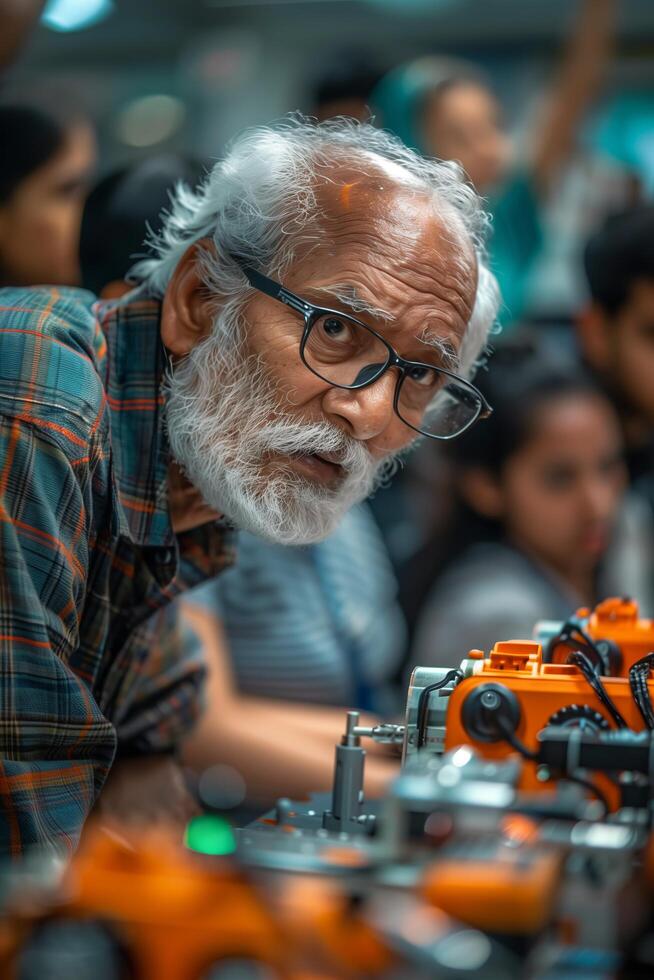 An older man with glasses and a beard working on a robot photo