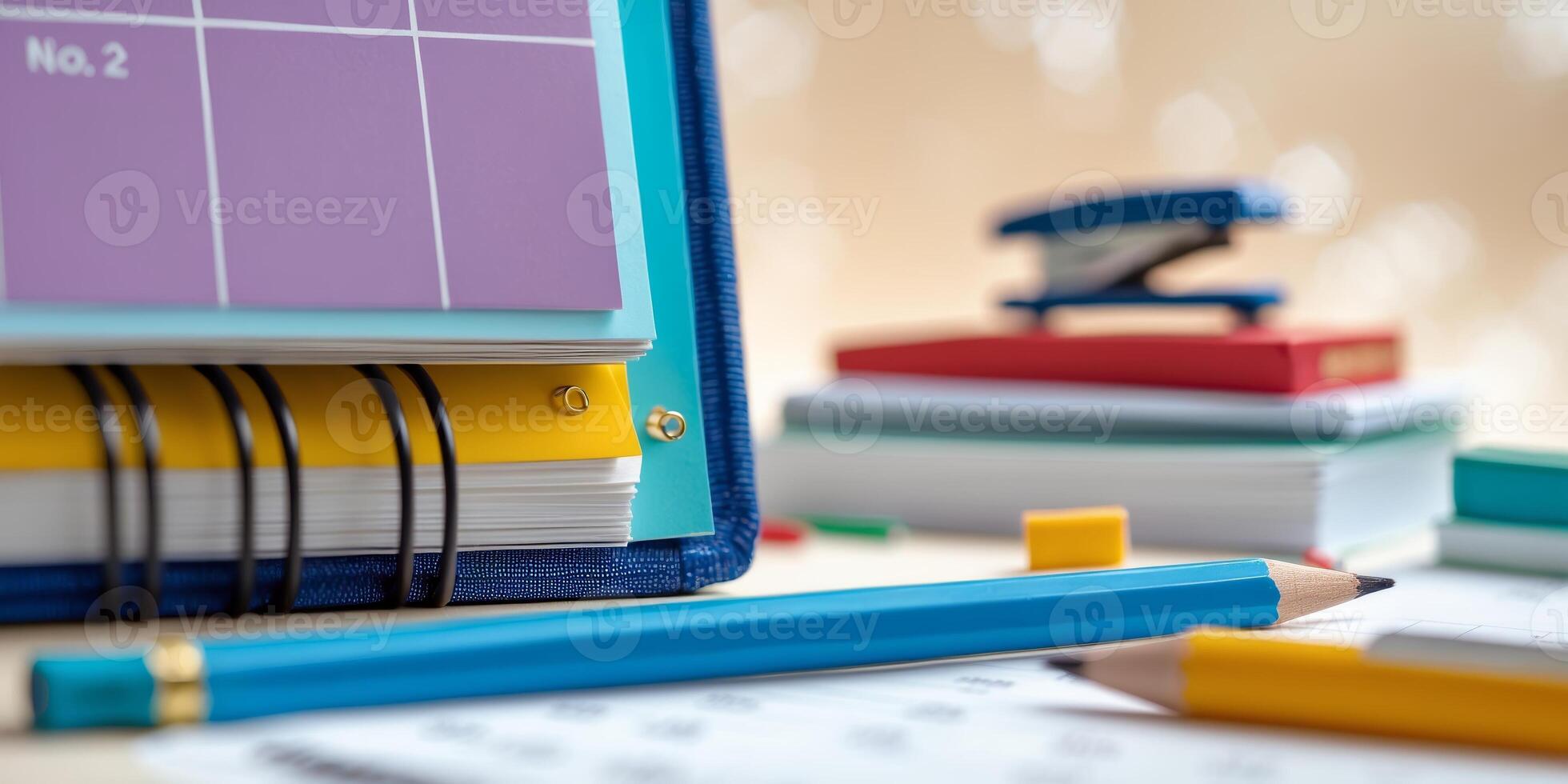 Colorful stationery and planning materials are arranged on a desk for organization and productivity during study time photo