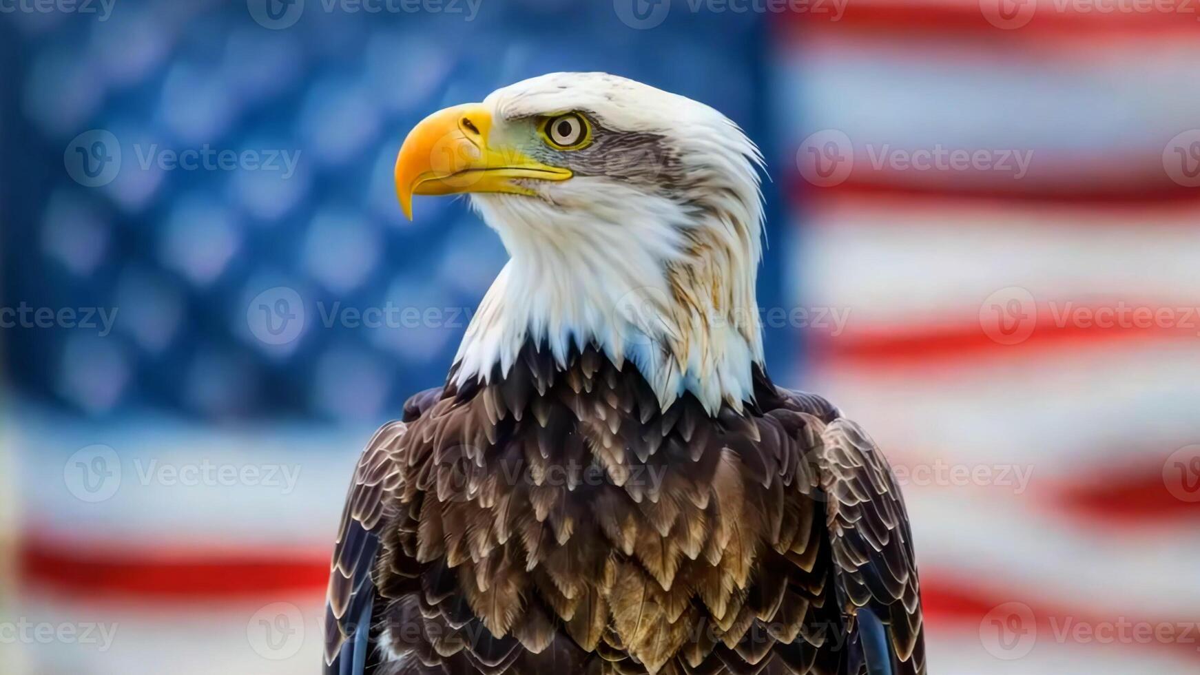 A bald eagle stands in front of an American flag. photo