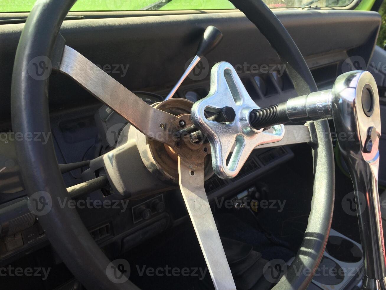 Steering Wheel with Puller Tool on a 1990s SUV, Working on the Turn Signals photo