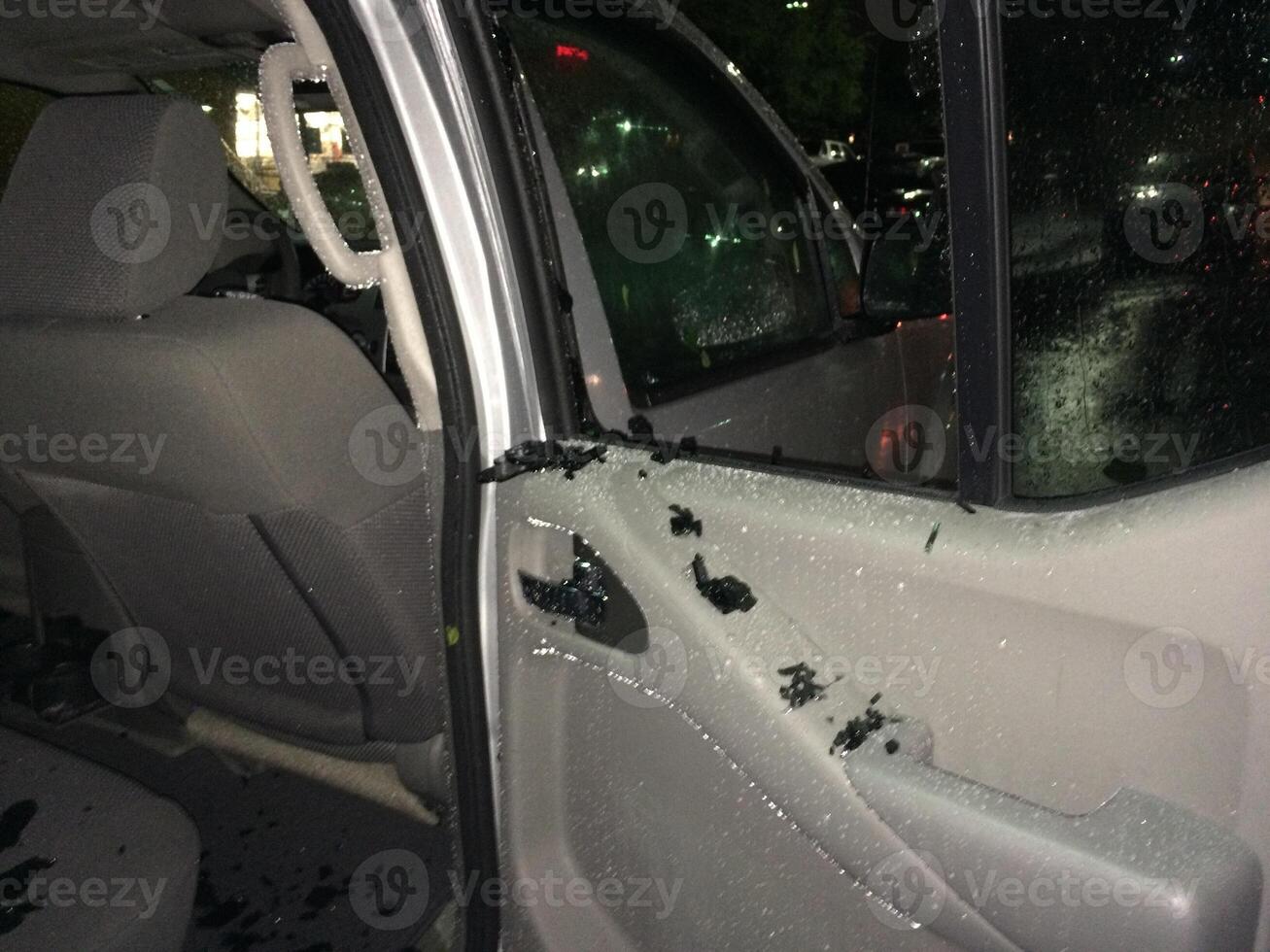 Hail Damage to Car, Broken Back Window from Inside photo