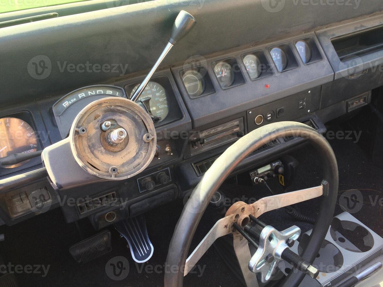 Steering Wheel Removed with Puller Tool on a 1990s SUV photo