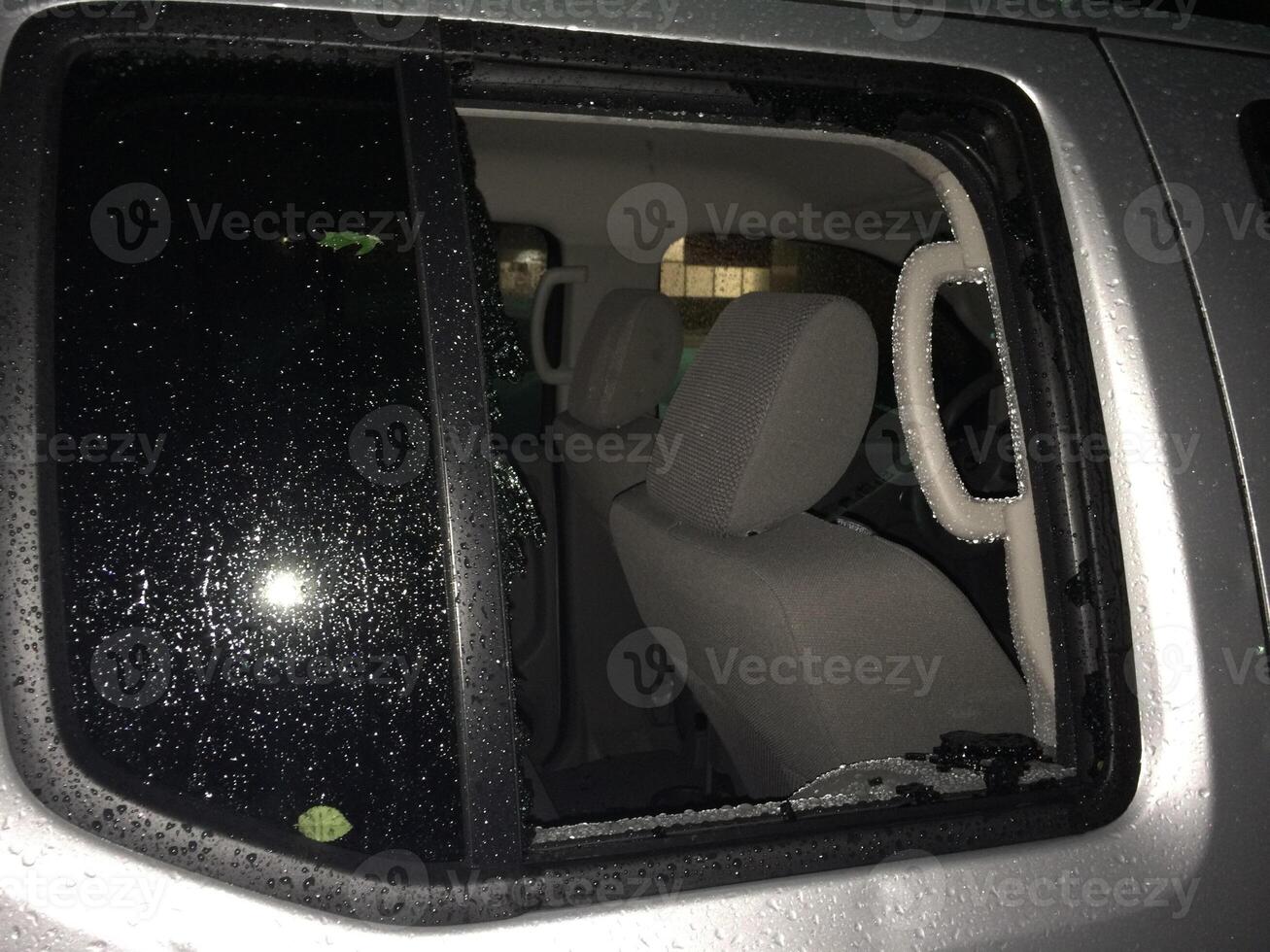 Hail Damage to Car, Broken Side Window of Pick Up Truck photo