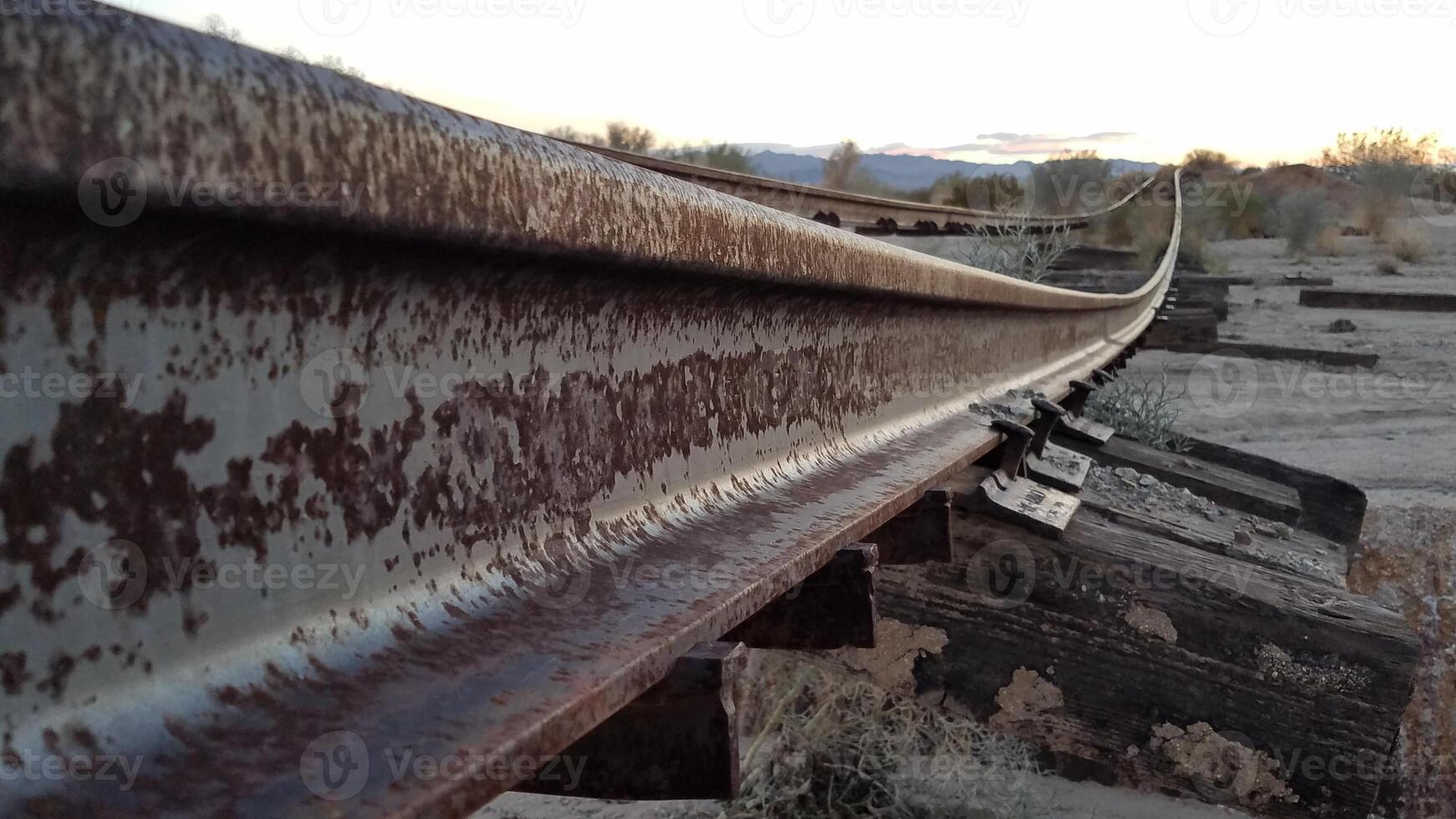 Rusty Old Abandoned Railroad Track Bending, Bridge Gone, Southern California photo