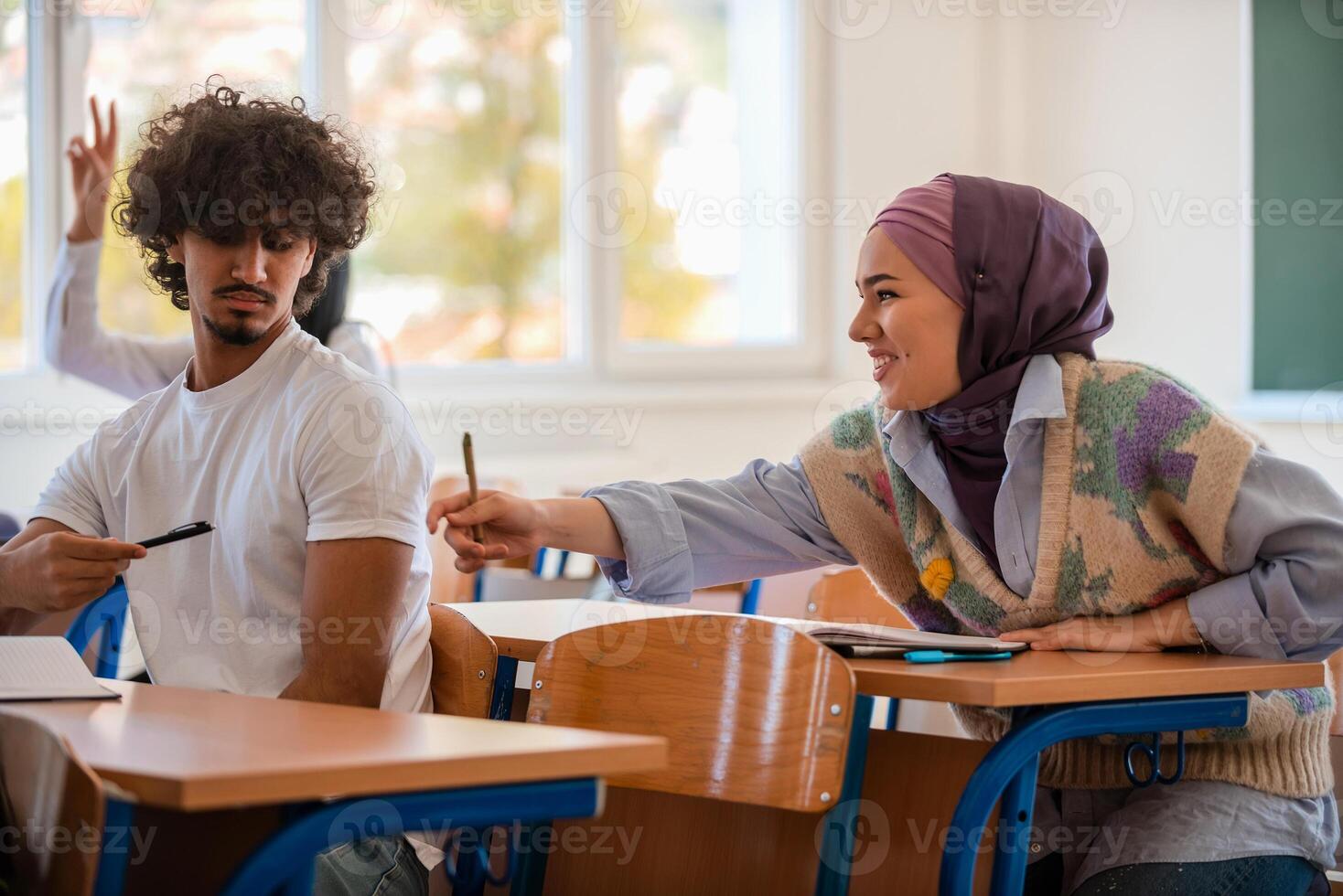 In the classroom group of diverse college students engages in discussion and knowledge exchange. photo