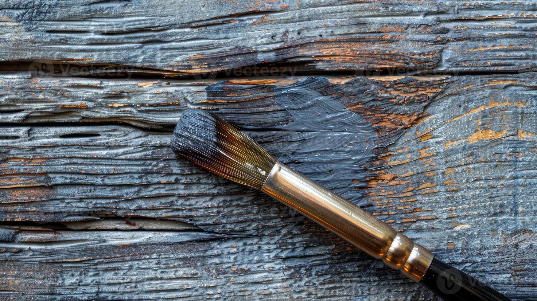 A brush on a wooden surface photo