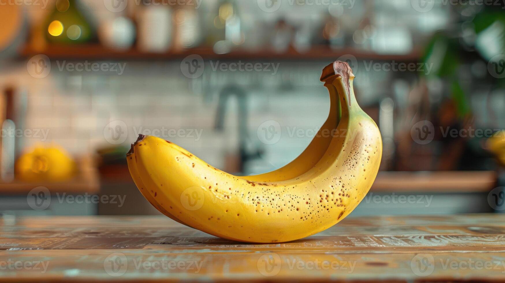 A ripe banana on a wooden table. photo