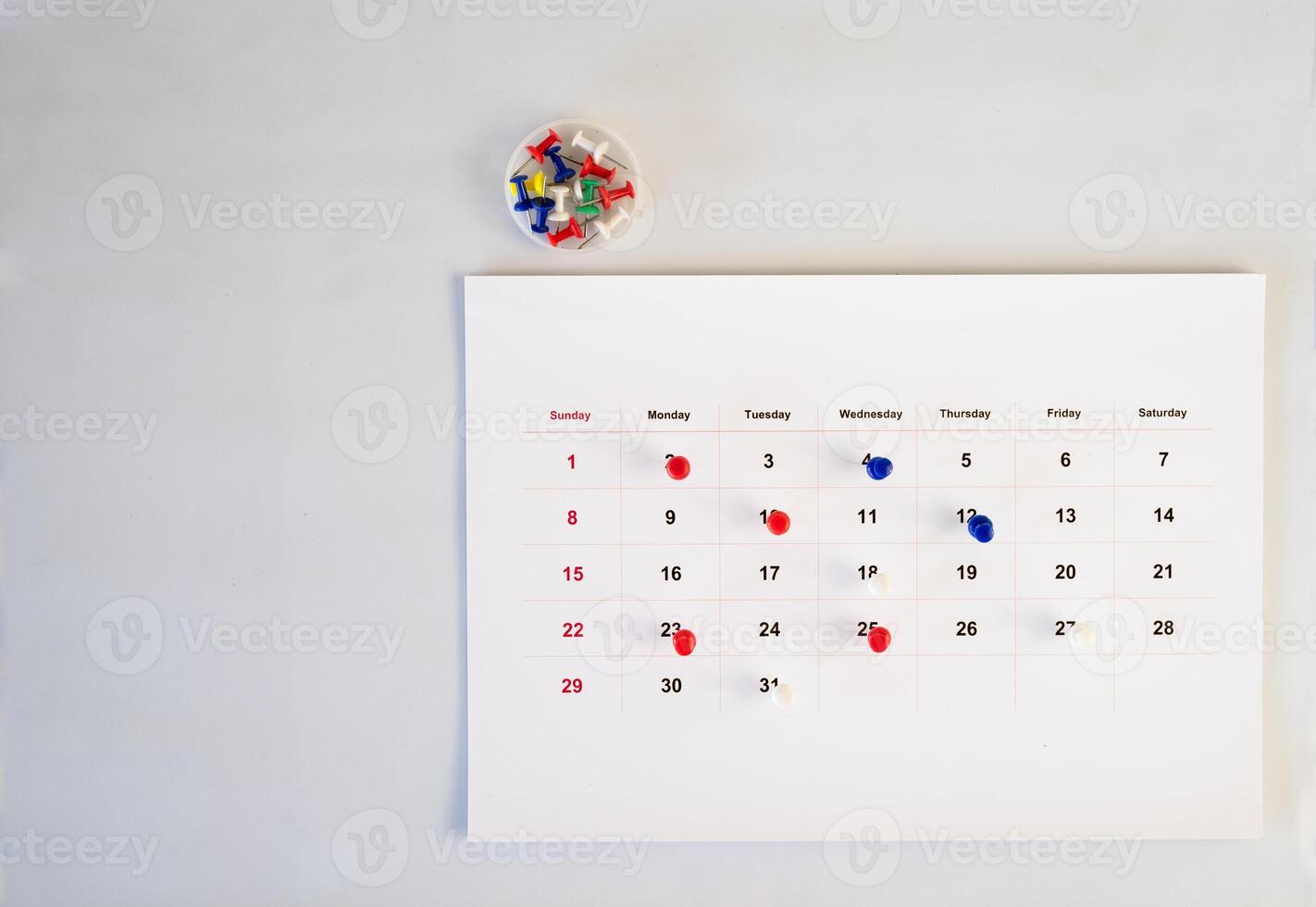 push pin stack in calendar background photo