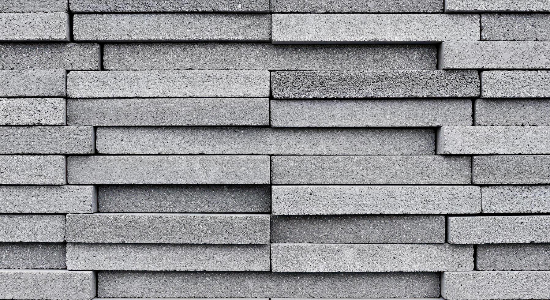 A wall made of gray bricks with a pattern photo