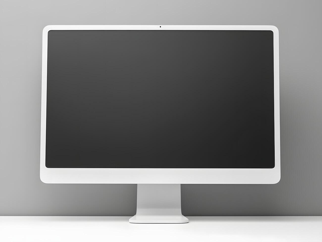 A white computer monitor sitting on a desk photo