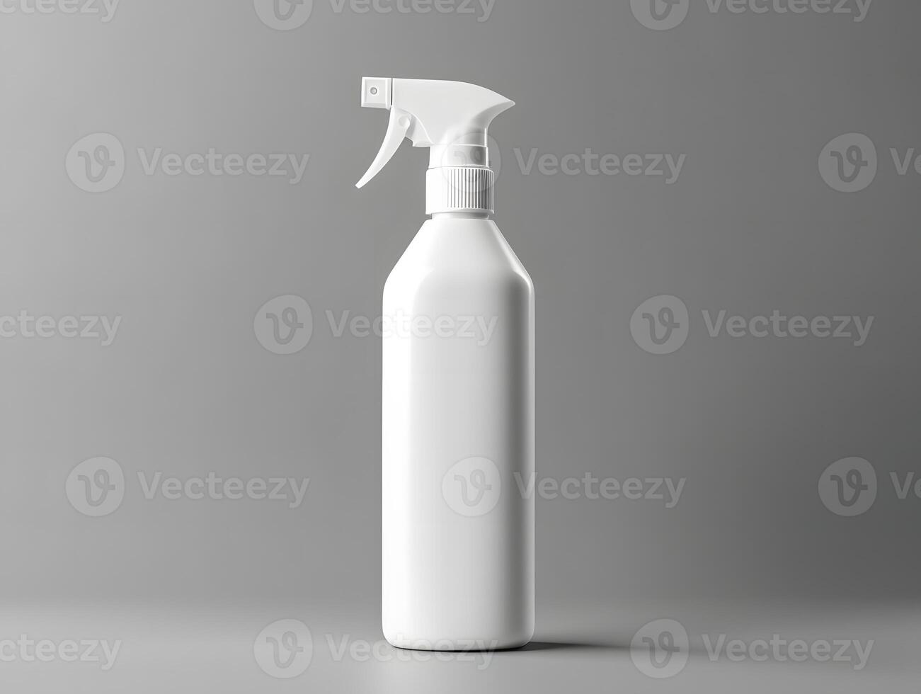 A white spray bottle on a gray background photo