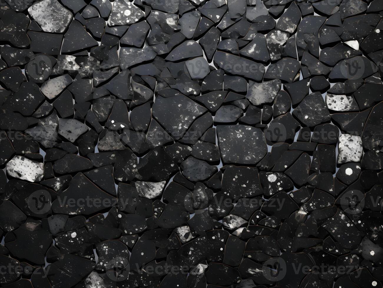 A black and white photo of a wall with many pieces of stone