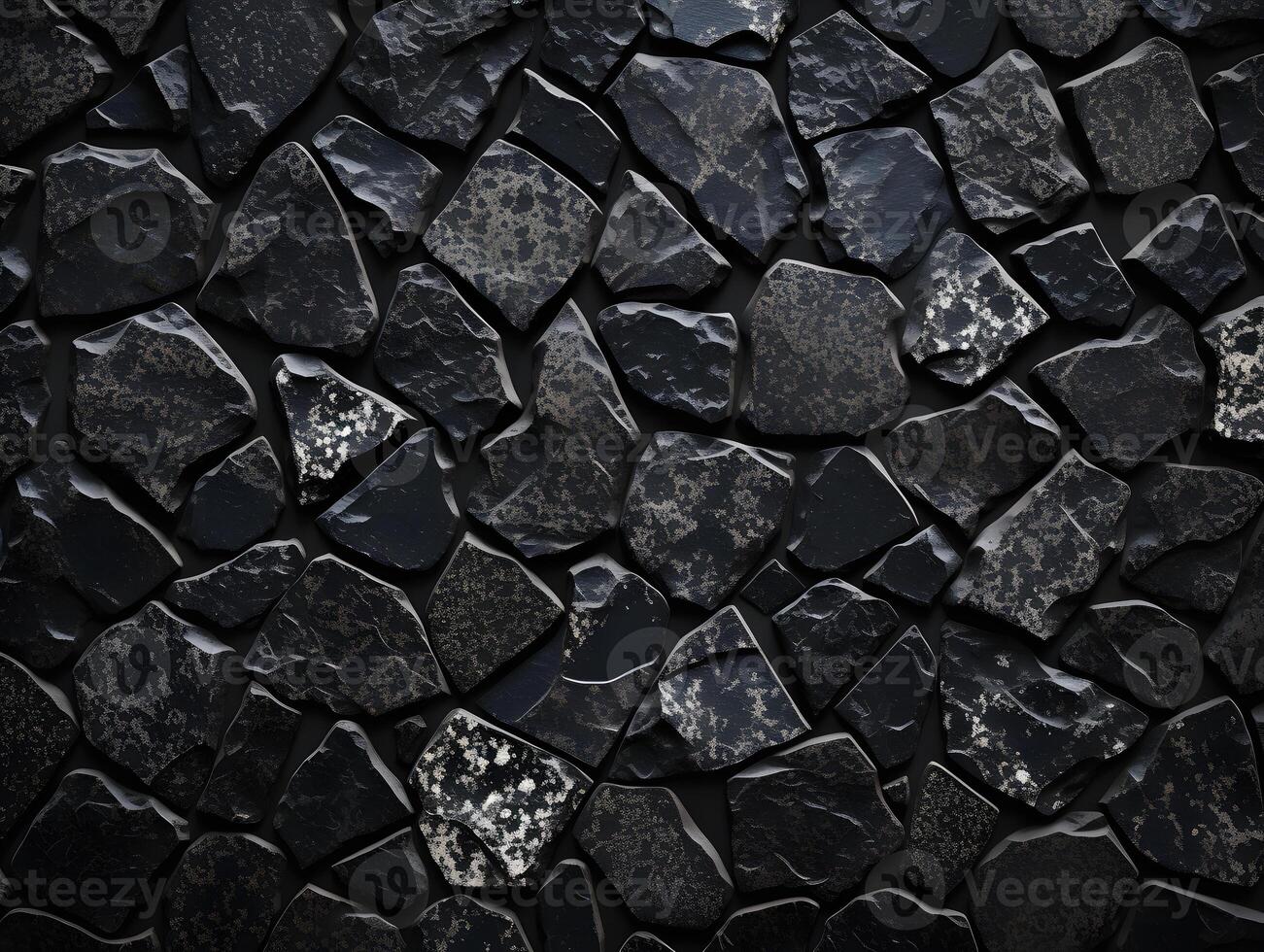 A black stone wall with many different shapes photo