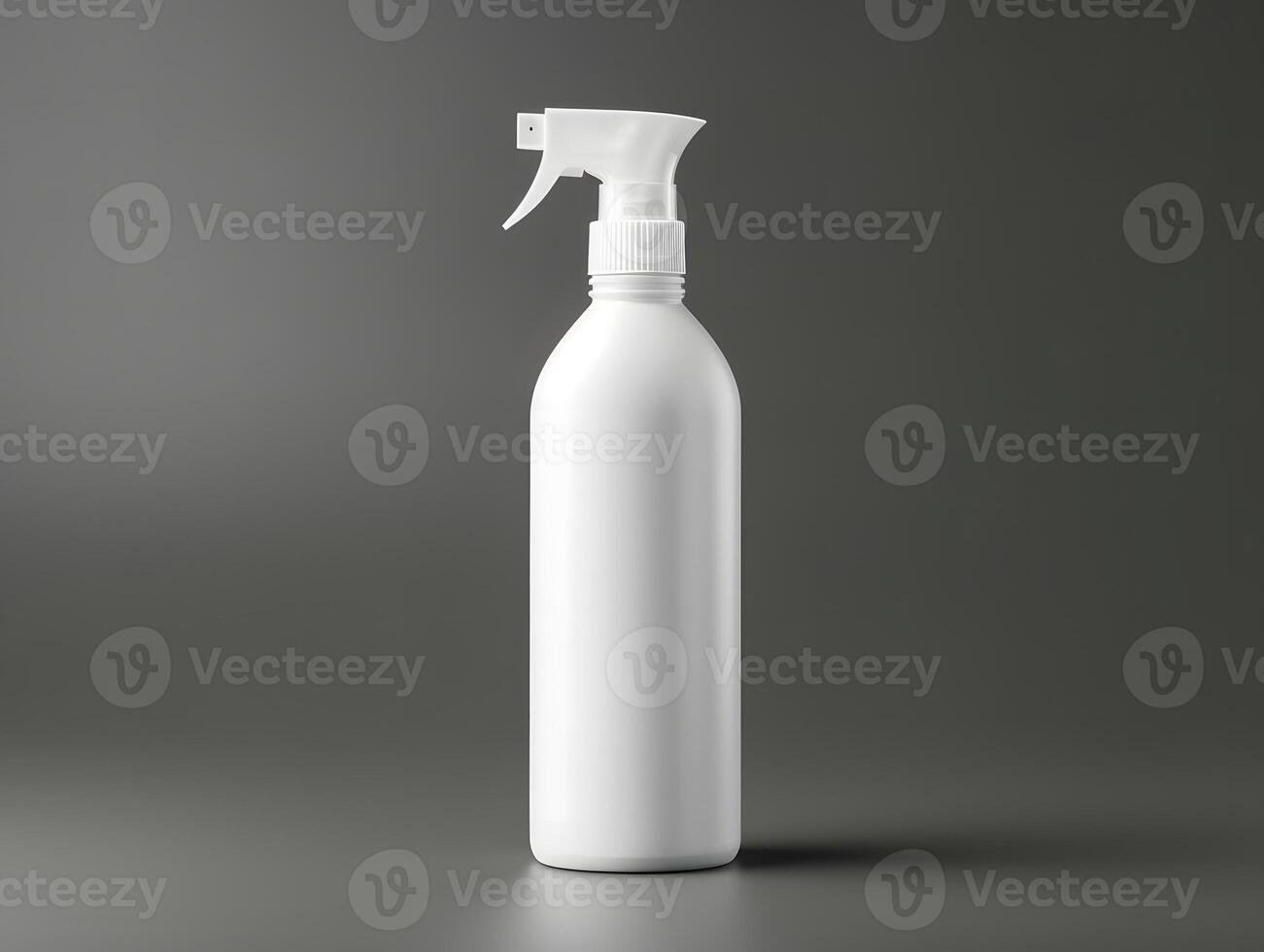 White spray bottle with a spray nozzle on a gray background photo