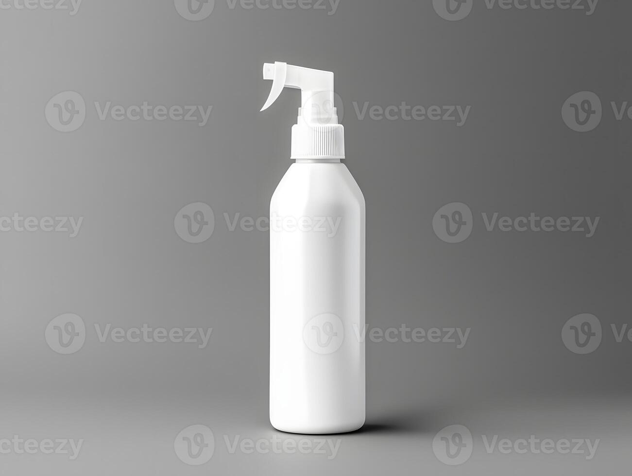 White spray bottle with a spray nozzle on a gray background photo
