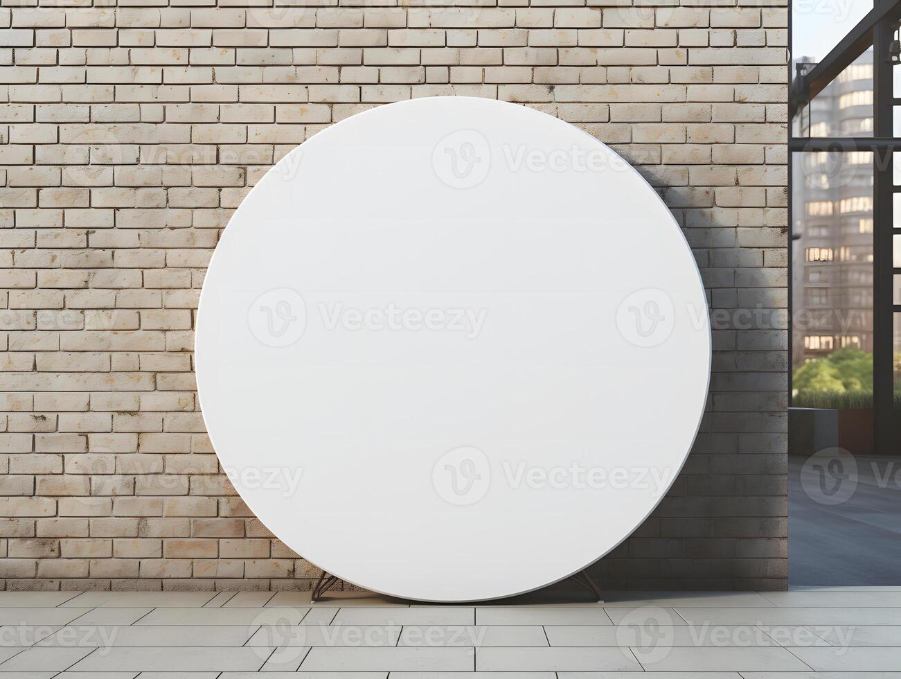 Round white mockup on brick wall in front of a window photo