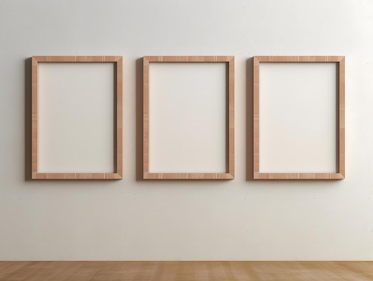 Three empty frames on a wall in an empty room photo