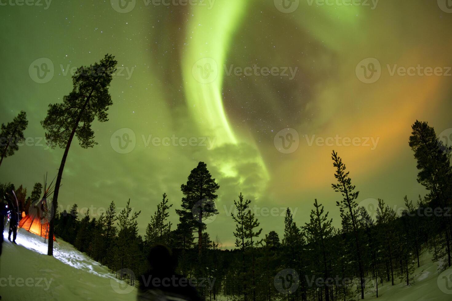 Northern Lights in Lapland Inari Nelli Lakes forest with a tepee tent sami photo