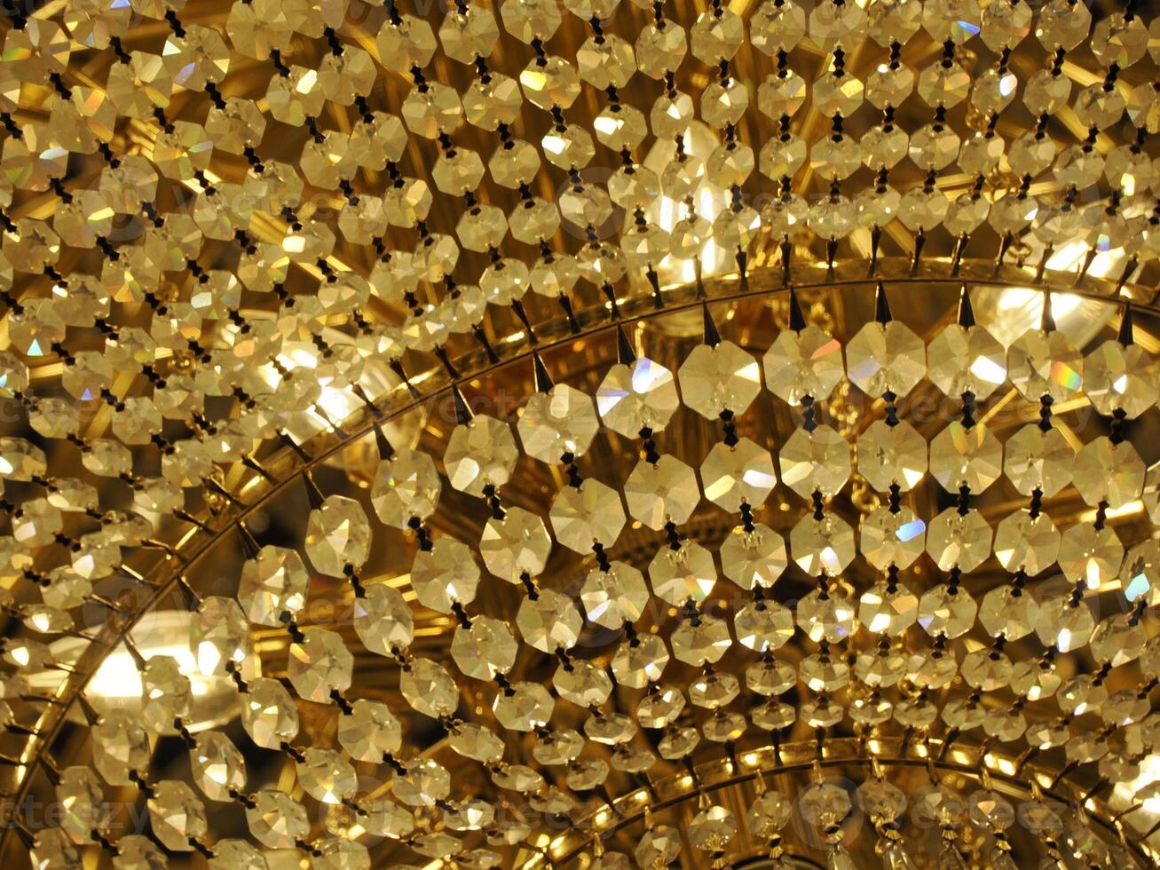 Crystal chandelier detail close up of glass diamonds photo