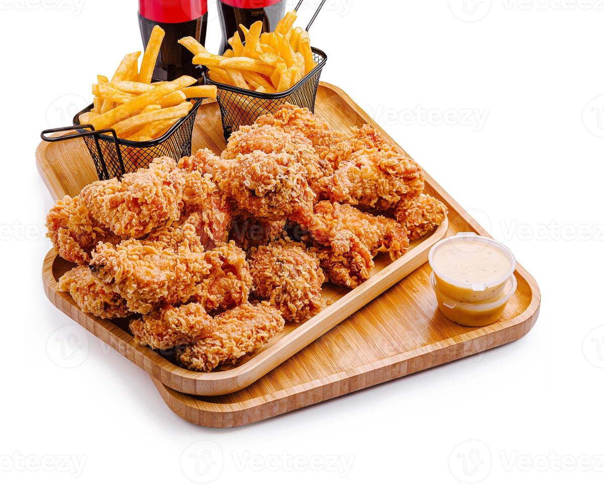 Fried chicken platter served with fries and drinks on a tray photo