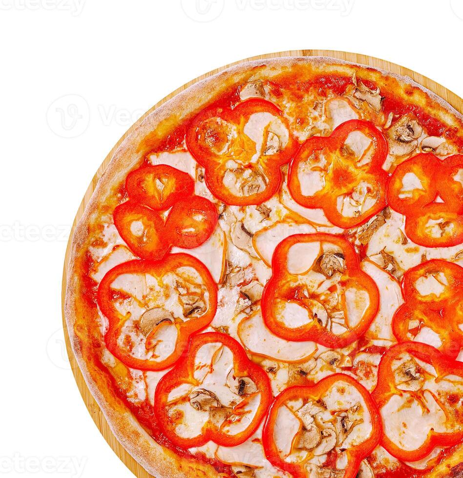 Delicious pizza topped with red peppers and mushrooms on wooden board photo